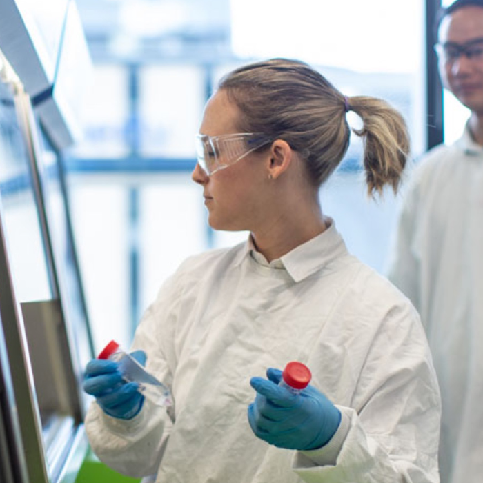 Researcher holding test tubes