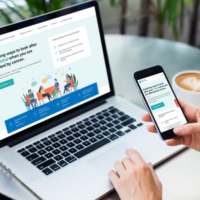 Viewing Cancer Mind Care on laptop and phone
