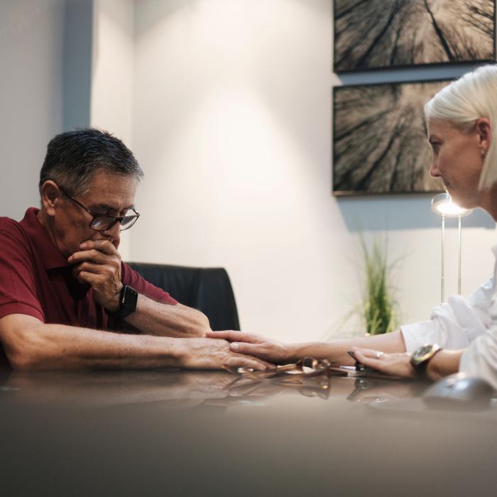 Female Doctor comforting Male patient