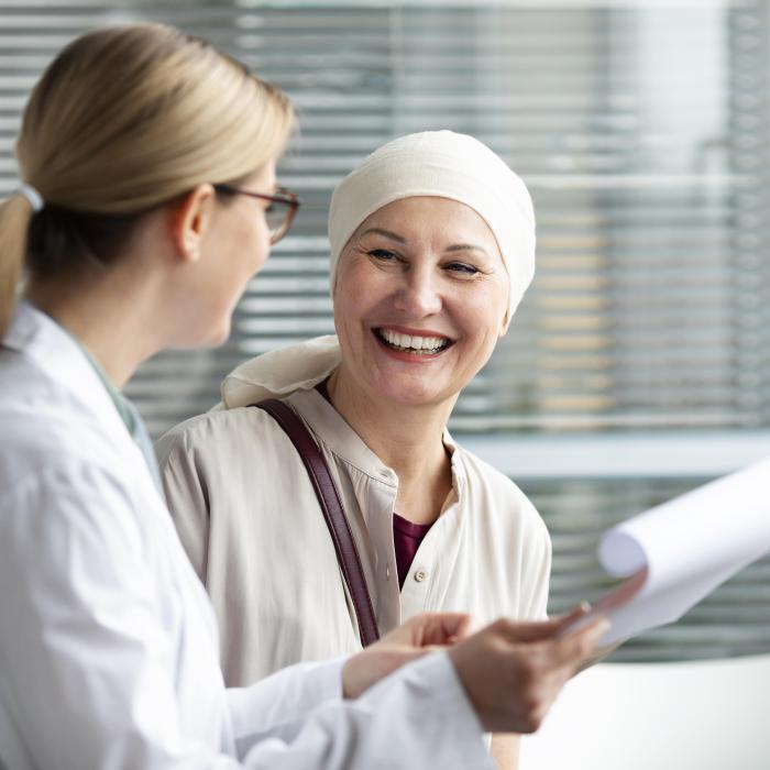 middle-aged-woman-with-skin-cancer-talking-with-her-doctor