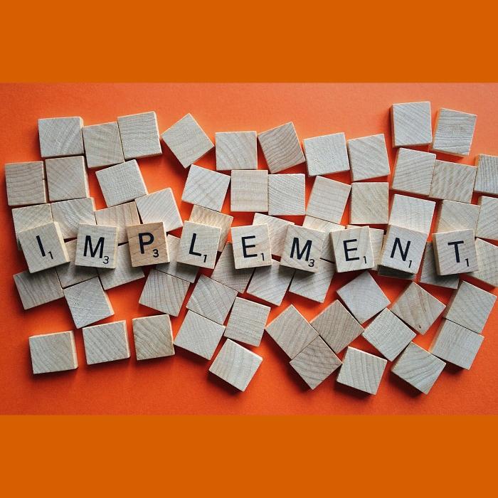 Implement spelt out in letter tiles