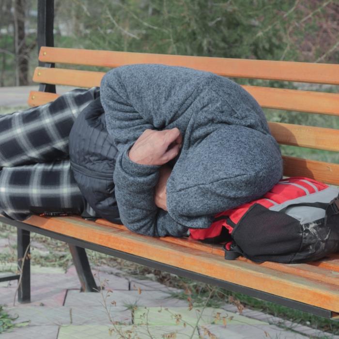 Homeless person on a bench