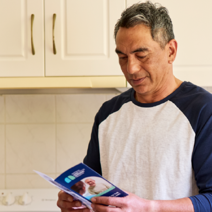 consumer reading lung cancer screening pamphlet 